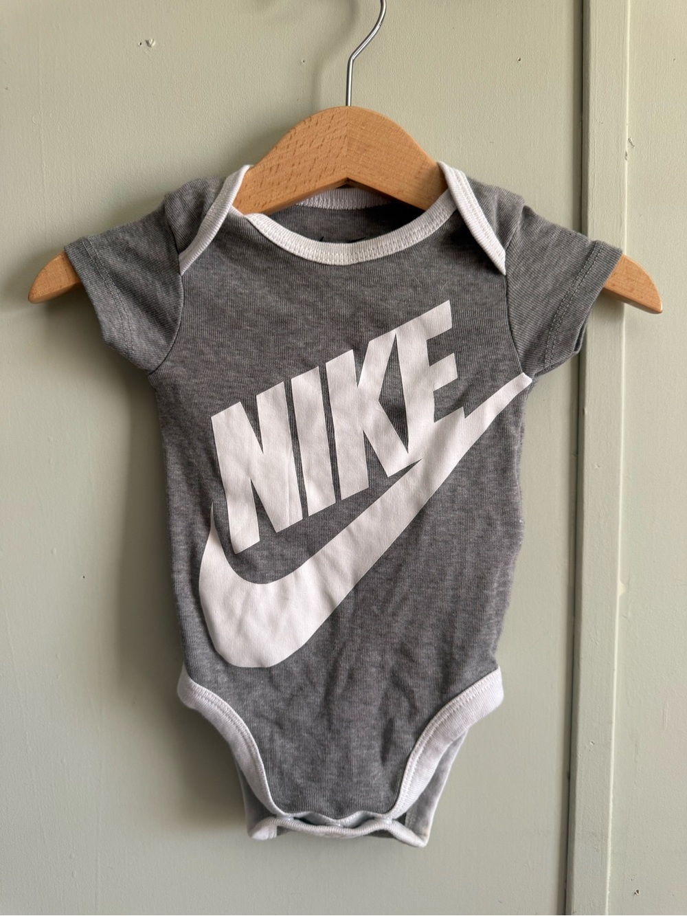 Nike Gray and White Logo Baby Bodysuit